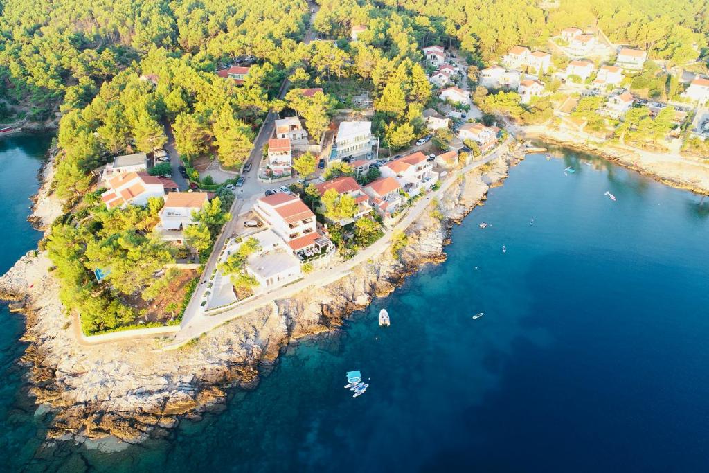 an aerial view of a house on an island in the water at Hvar beach vacation in Vrboska