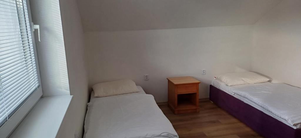 Postel nebo postele na pokoji v ubytování Apartmánový dům TERKA