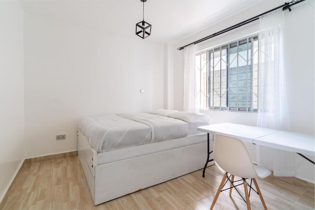 Una cama o camas en una habitación de Viok Homes