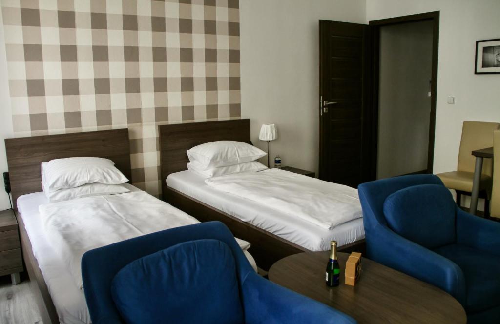 Postel nebo postele na pokoji v ubytování Hotel Residence Spalena