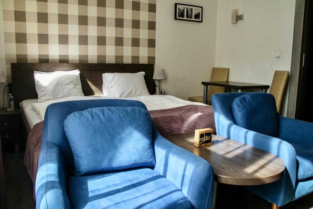 Postel nebo postele na pokoji v ubytování Hotel Residence Spalena