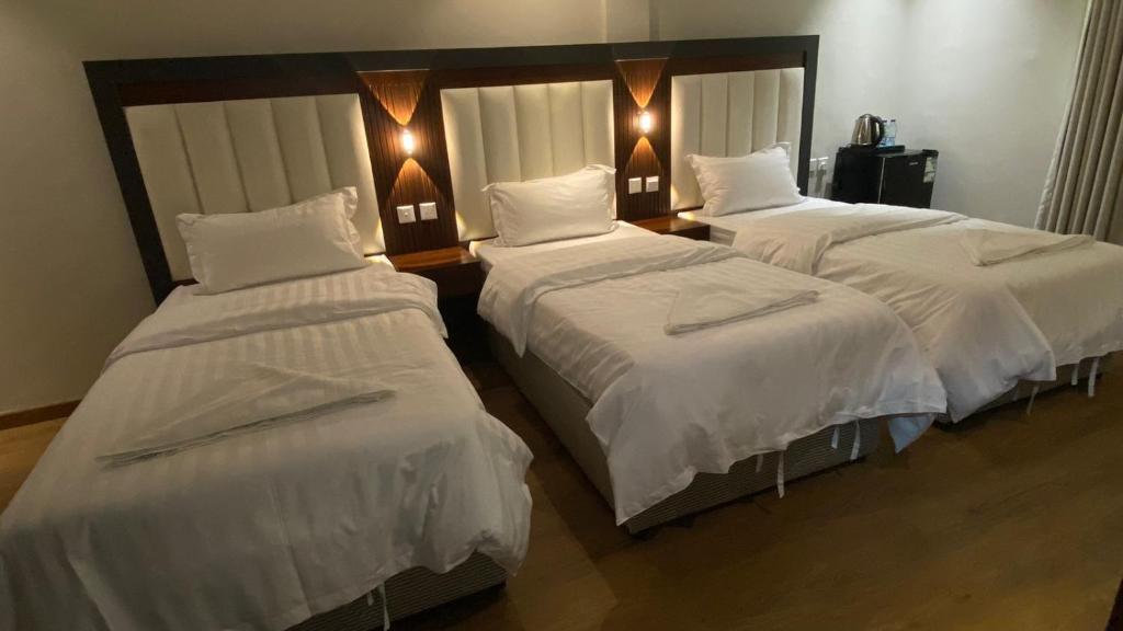 Postel nebo postele na pokoji v ubytování Diva Hotel 2