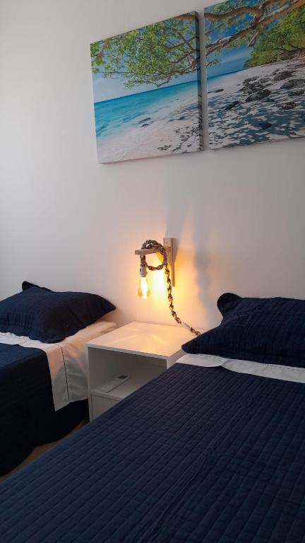 Postel nebo postele na pokoji v ubytování Village em Itacimirim lindo, novo e tranquilo à 400 m da Praia da Espera