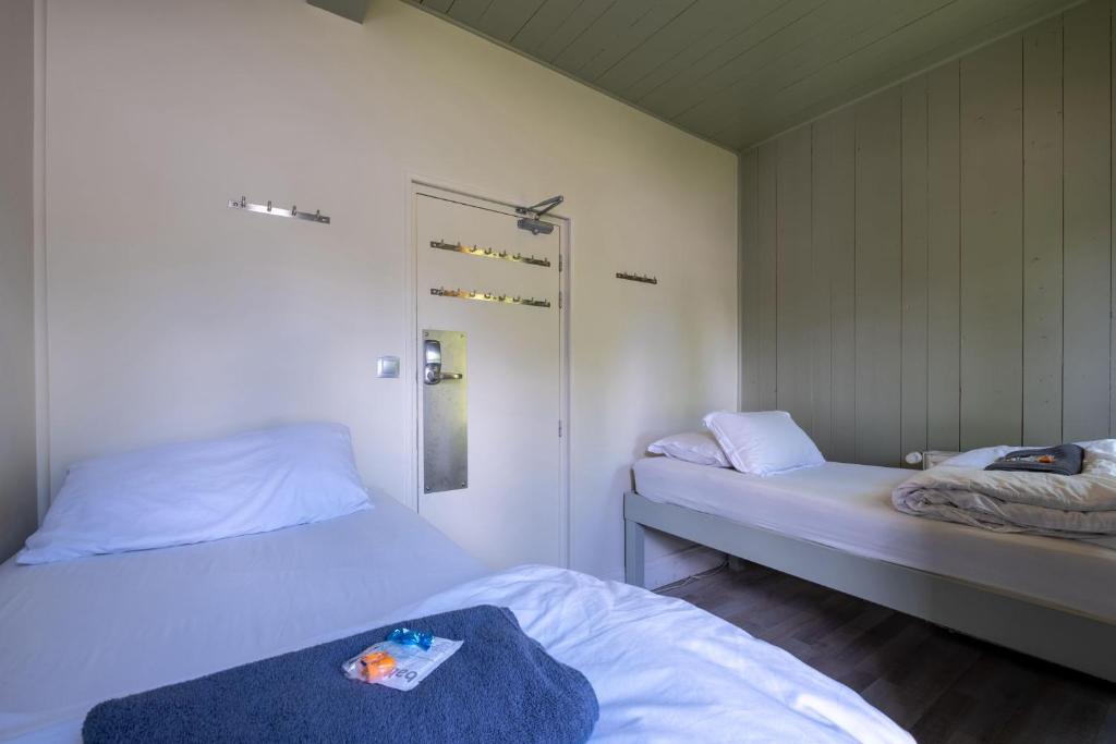 Postel nebo postele na pokoji v ubytování Vert Lodge Chamonix