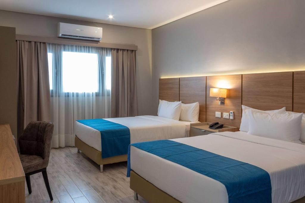 Uma cama ou camas num quarto em Tryp by Wyndham Asuncion