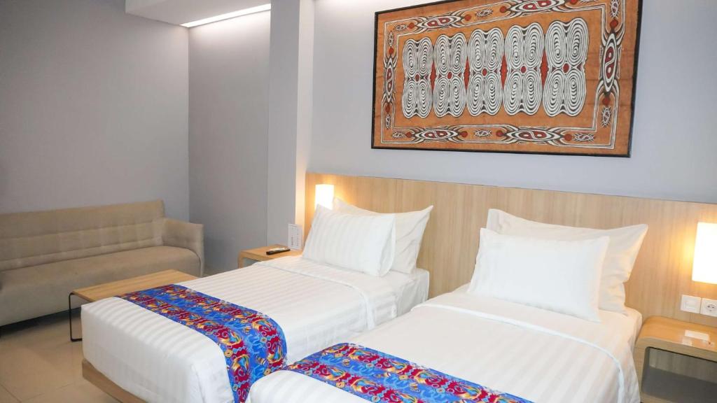 Postel nebo postele na pokoji v ubytování Best Western Sagita Hotel Jayapura