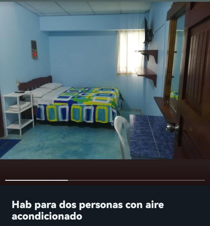 Postel nebo postele na pokoji v ubytování Hostal Aruba