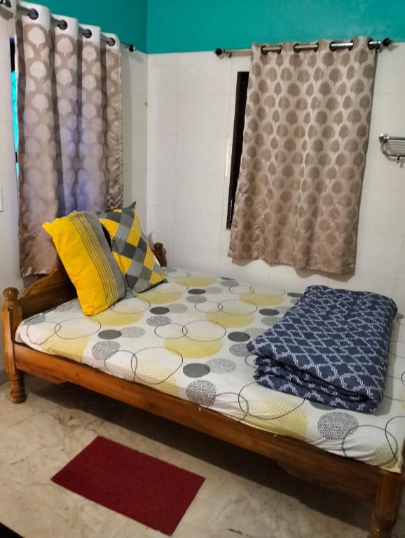 Postel nebo postele na pokoji v ubytování Okaasan Guest House