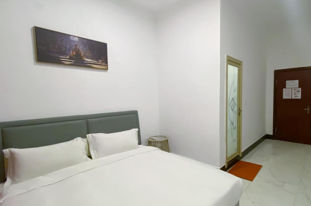 Postel nebo postele na pokoji v ubytování Easy Backpackers Paradise