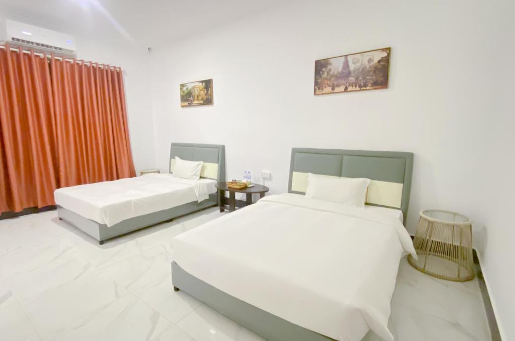 Postel nebo postele na pokoji v ubytování Easy Backpackers Paradise