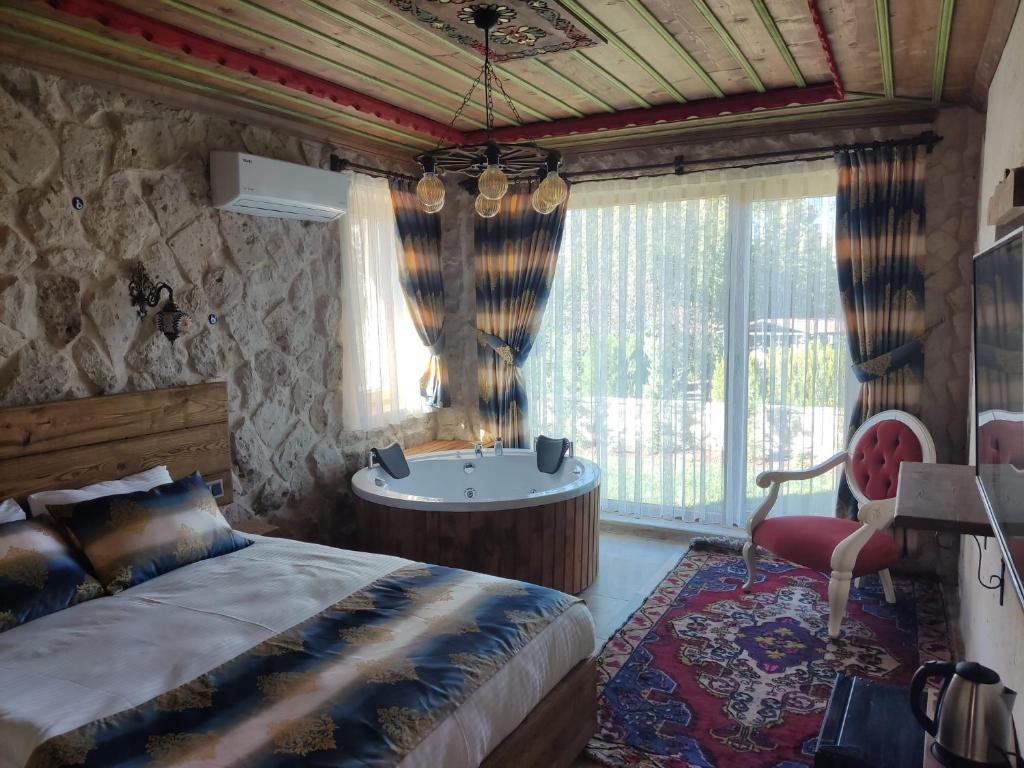 Postel nebo postele na pokoji v ubytování Fiesta Stone House