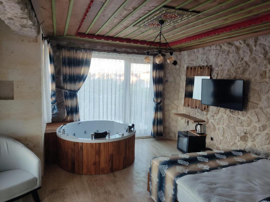 Postel nebo postele na pokoji v ubytování Fiesta Stone House