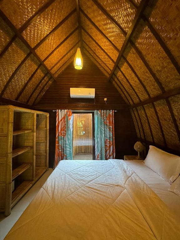 Postel nebo postele na pokoji v ubytování Sampai Jumpa Gili Air