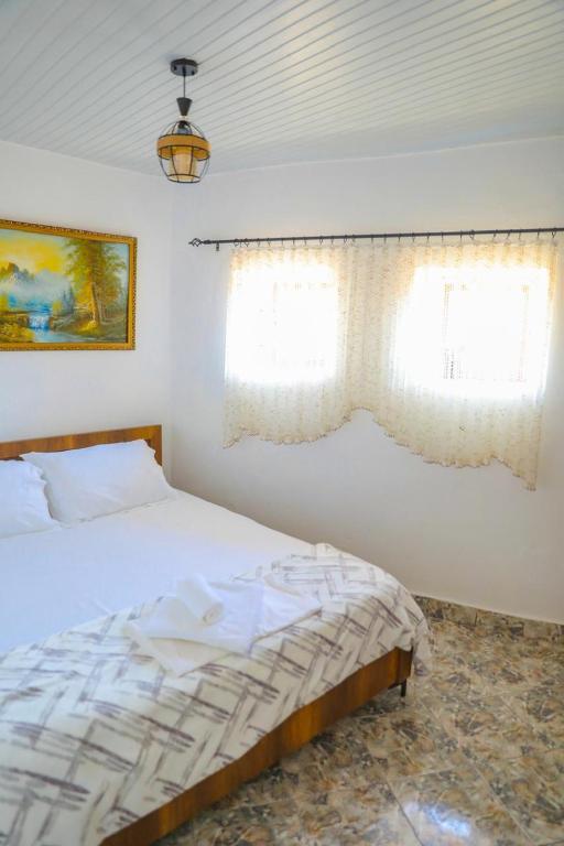 Postel nebo postele na pokoji v ubytování Guesthouse Gogu