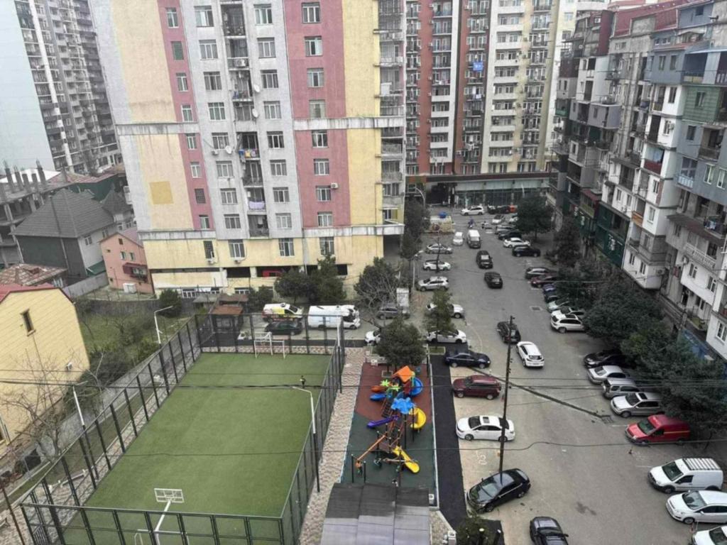an aerial view of a street with a tennis court at Apartment- GURO in Batumi
