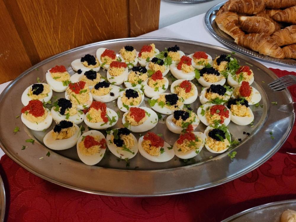 a tray filled with deviled eggs on a table at Hotel Merkur - Jablonec nad Nisou in Jablonec nad Nisou