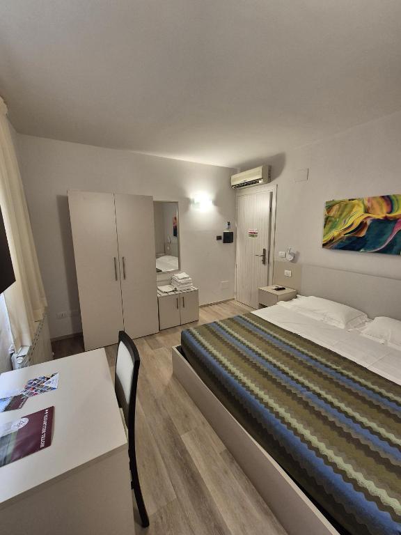 Postel nebo postele na pokoji v ubytování Hotel Bellavista
