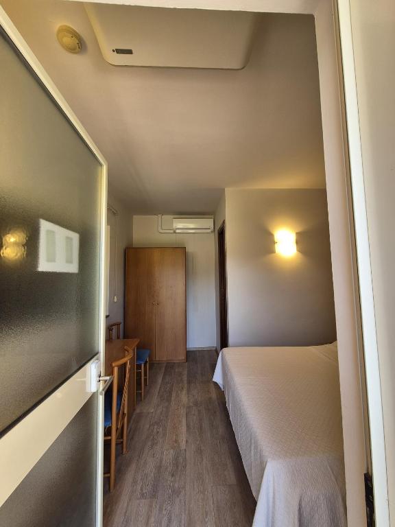 Postel nebo postele na pokoji v ubytování Hotel Bellavista