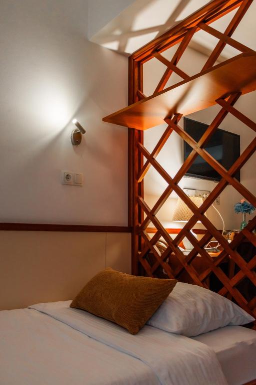 Postel nebo postele na pokoji v ubytování Hotel Saraj