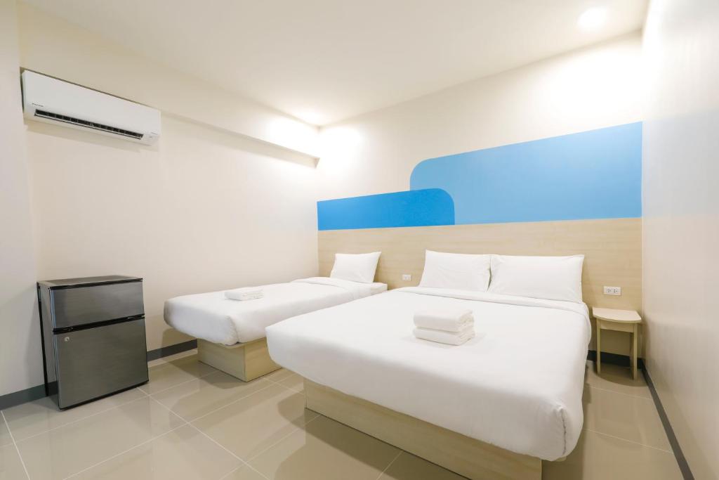 Postel nebo postele na pokoji v ubytování Hop Inn Hotel Davao