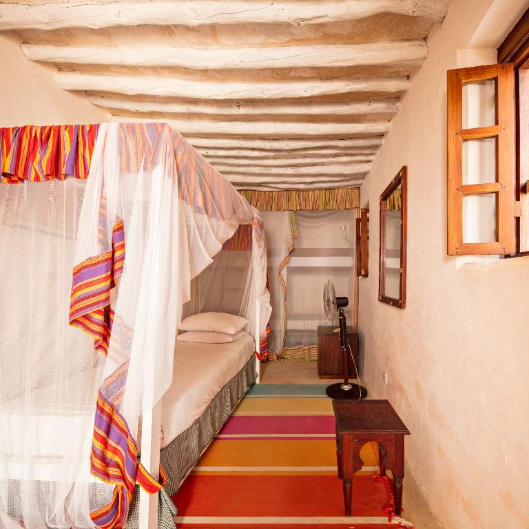 Voodi või voodid majutusasutuse Authentic Swahili style villa Milele House toas