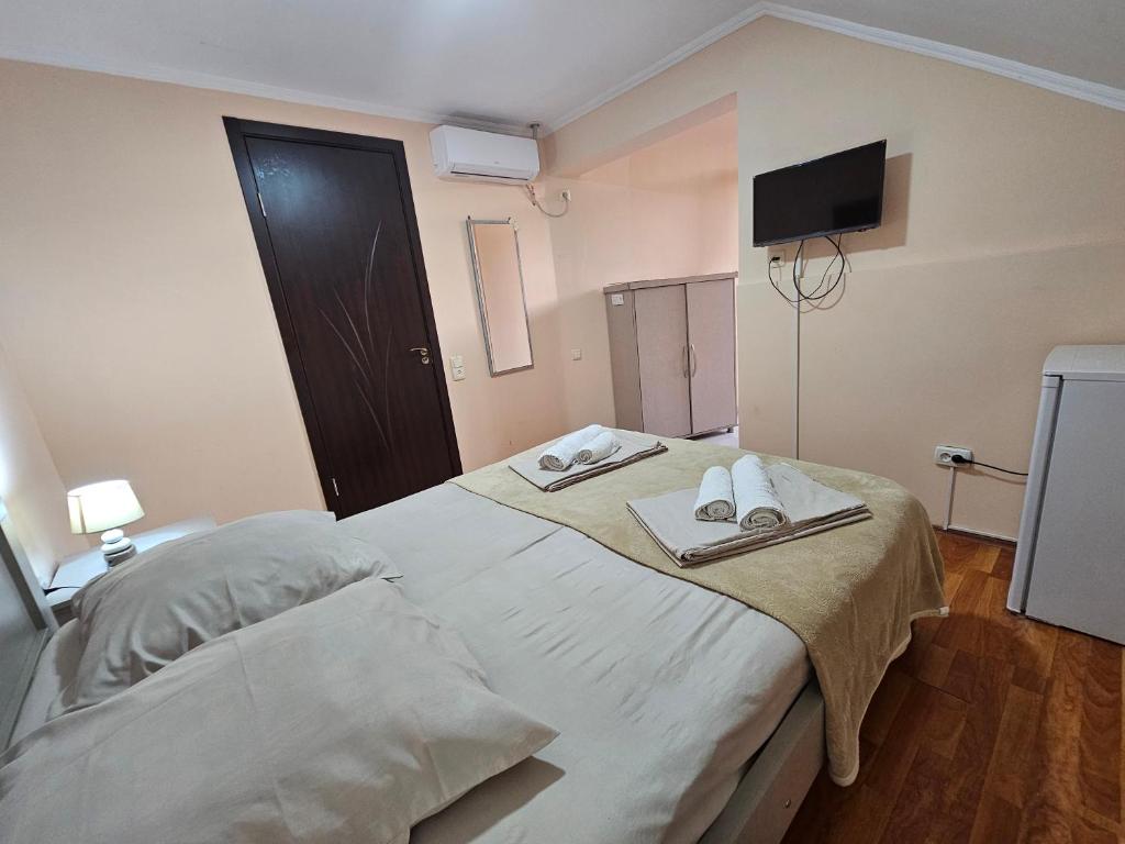 Postel nebo postele na pokoji v ubytování Imeri Hotel