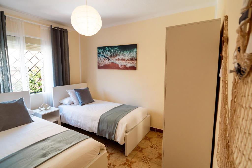 Posteľ alebo postele v izbe v ubytovaní Sea Life Salou Apartment