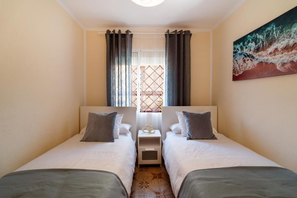Posteľ alebo postele v izbe v ubytovaní Sea Life Salou Apartment
