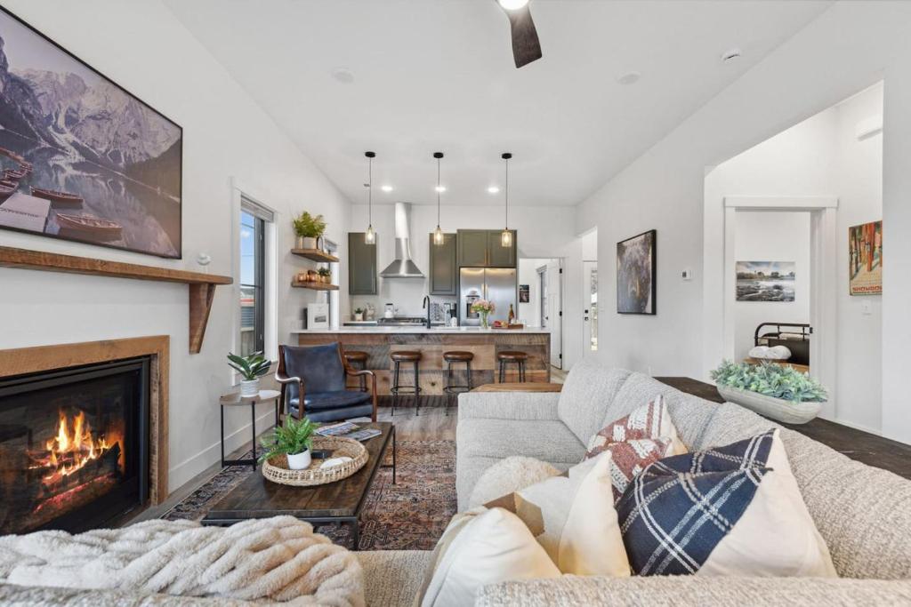a living room with a couch and a fireplace at ZOOTown The Blue Bungalow in Missoula