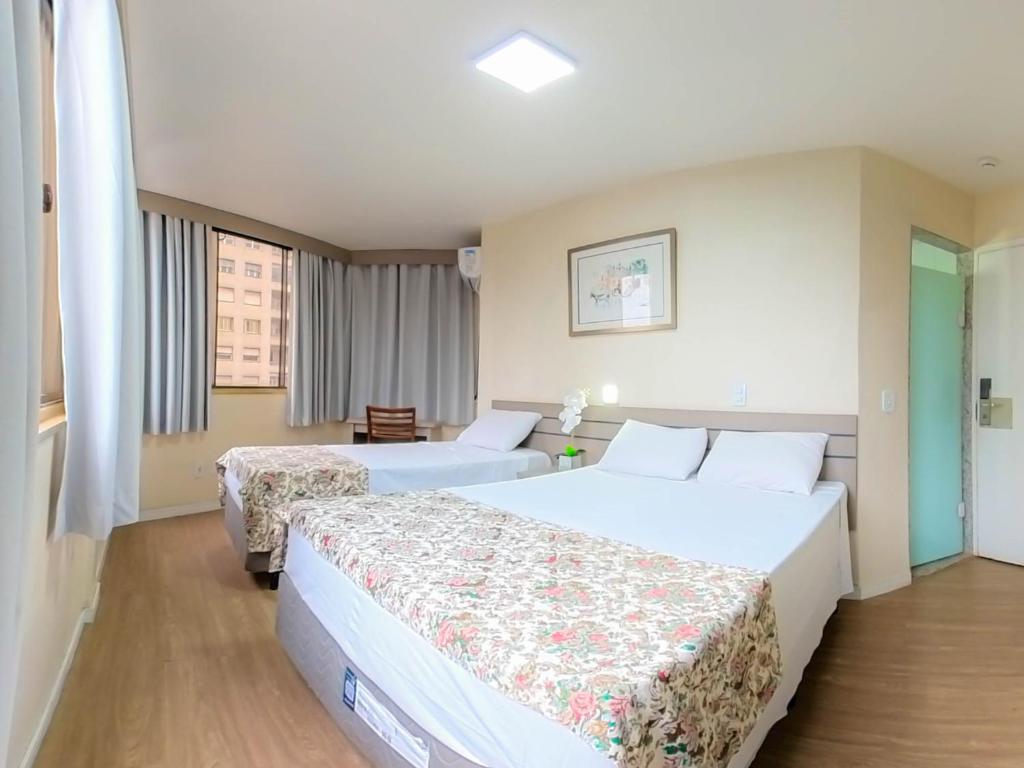 Dan Inn São Paulo Higienópolis by Nacional Inn - PRÓXIMO À AV PAULISTA tesisinde bir odada yatak veya yataklar