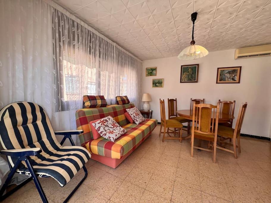 a living room with a couch and chairs and a table at Costa Cunit in Cunit
