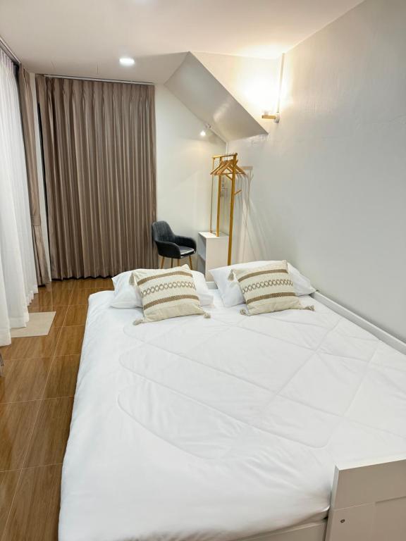 Ένα ή περισσότερα κρεβάτια σε δωμάτιο στο Tata pool villa pattaya