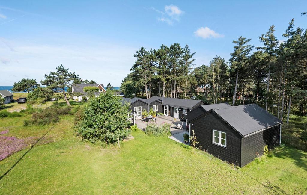 an overhead view of a black house with a yard at 5 Bedroom Awesome Home In Slagelse in Slagelse