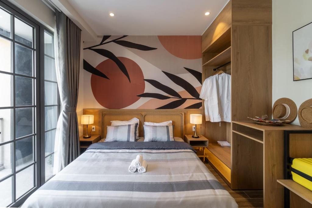 Postel nebo postele na pokoji v ubytování Nhà phố 3Pn Coral Home Novaworld Phan Thiết