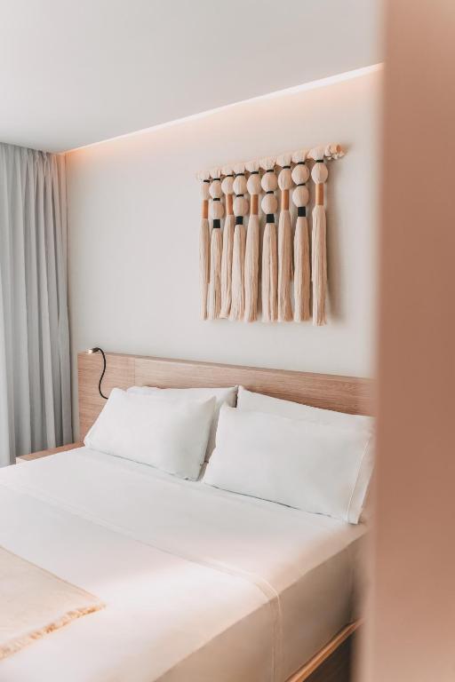 Postel nebo postele na pokoji v ubytování AKEN MIND Mérida Hotel