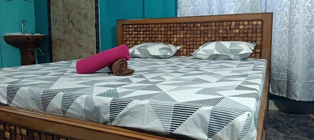 Postel nebo postele na pokoji v ubytování Move inn Sivsagar