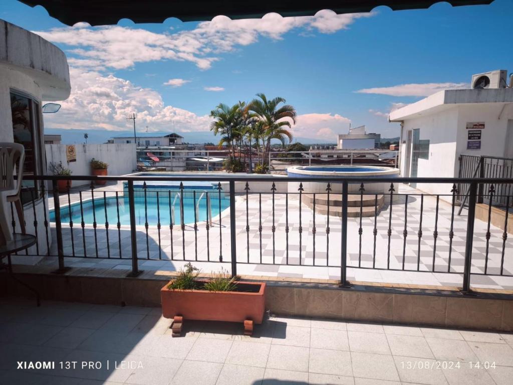 a view of a swimming pool from a balcony at Hotel Cafe Plaza in Tuluá