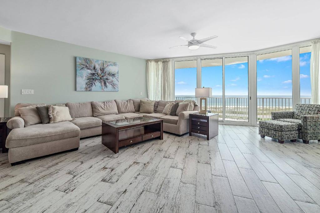 a living room with a couch and a table at Caribe D-1214 in Orange Beach