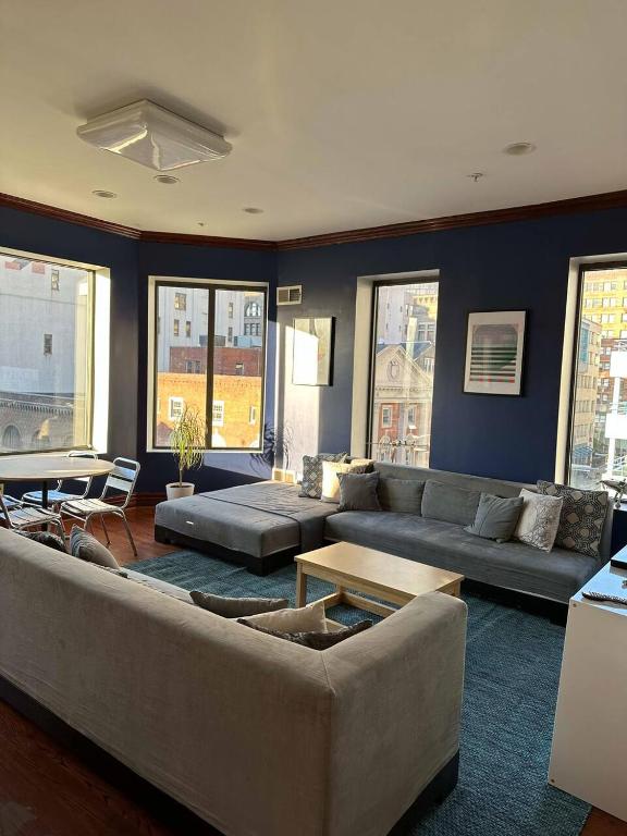 a living room with a couch and a table at Stay Pittsburgh in Pittsburgh