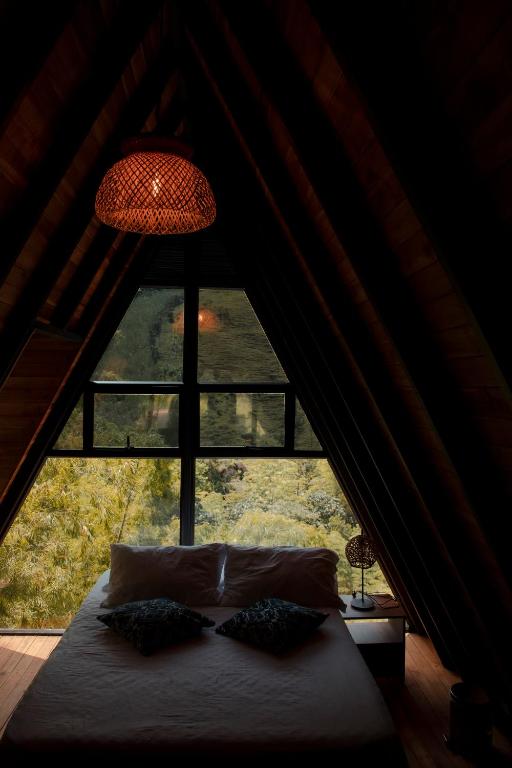 Postel nebo postele na pokoji v ubytování EcoHotel Casa Maria Parda