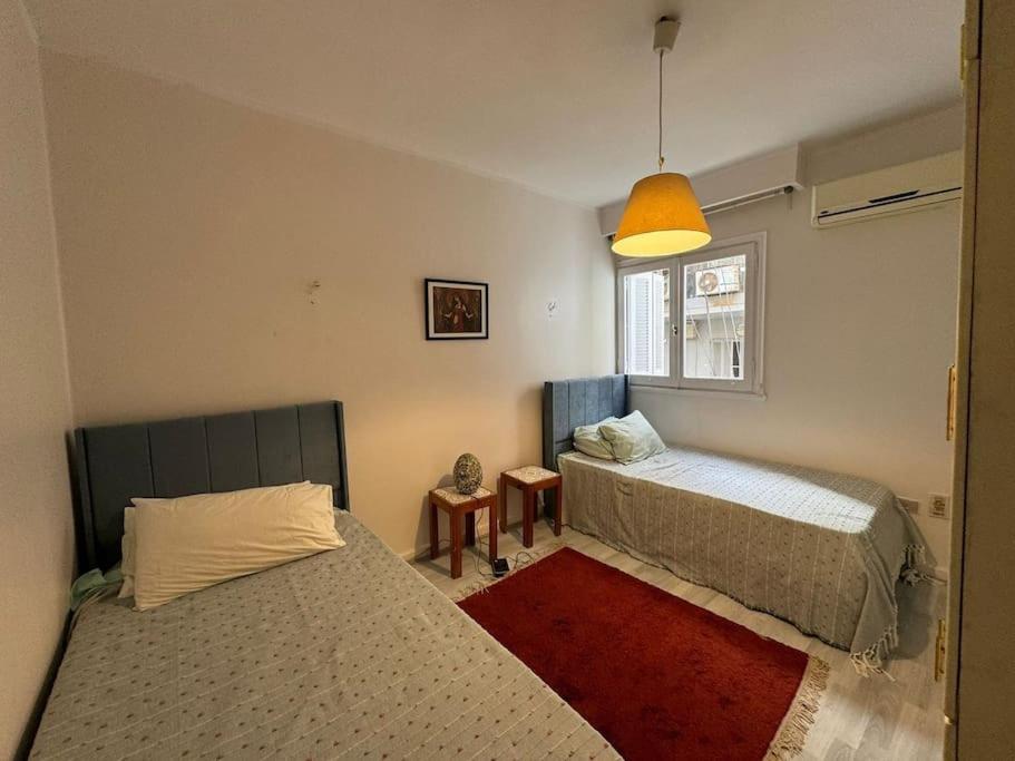 Postel nebo postele na pokoji v ubytování The Nest, Zamalek