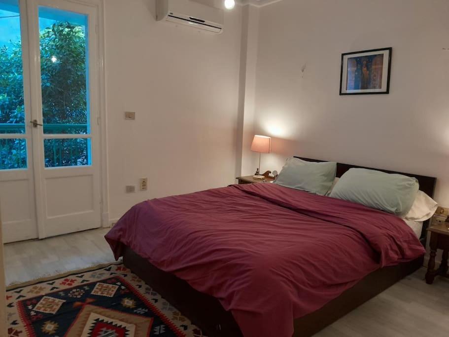 Postel nebo postele na pokoji v ubytování The Nest, Zamalek