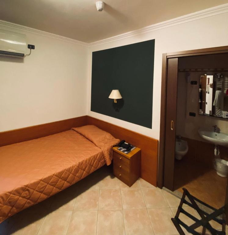 Postel nebo postele na pokoji v ubytování Hotel Romagna