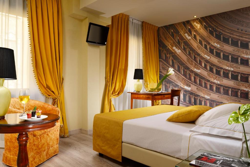 Postel nebo postele na pokoji v ubytování Hotel Pierre Milano