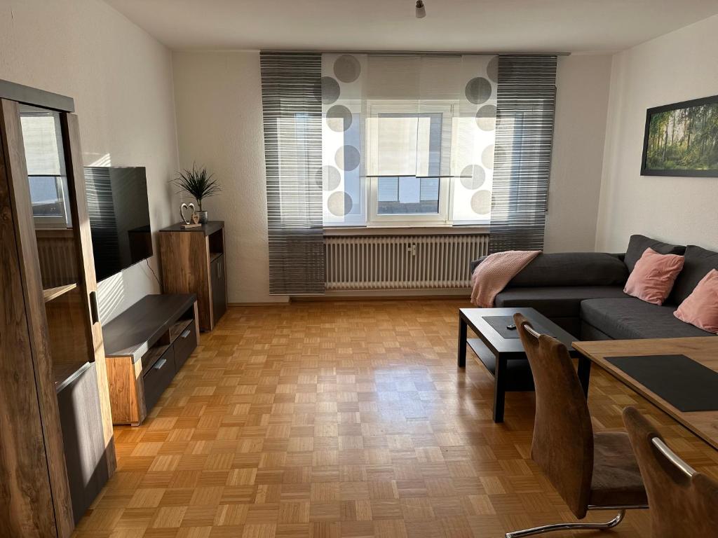 a living room with a couch and a table at Ferienwohnung Petry in Clausen