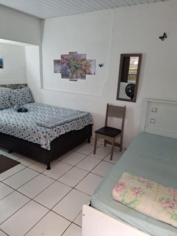 Postel nebo postele na pokoji v ubytování Sobrado Botafogo Guesthouse