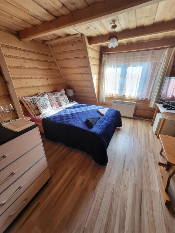 Posteľ alebo postele v izbe v ubytovaní Domek Jelonek