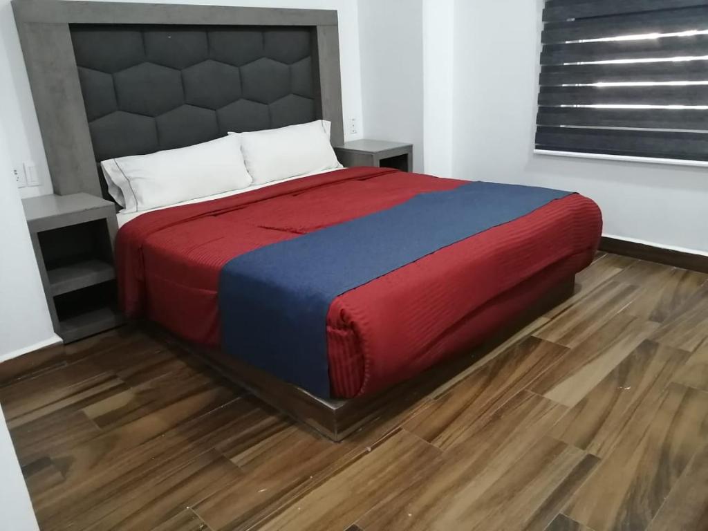 Postel nebo postele na pokoji v ubytování Hotel ANB Aeropuerto Guadalajara