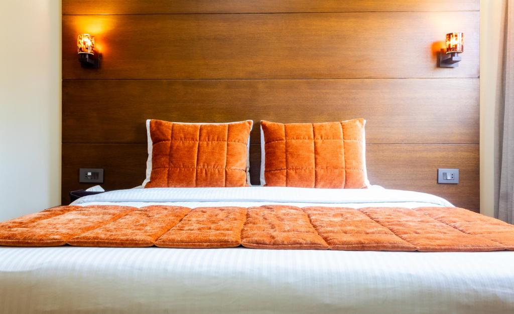 Postel nebo postele na pokoji v ubytování Britannia Suites