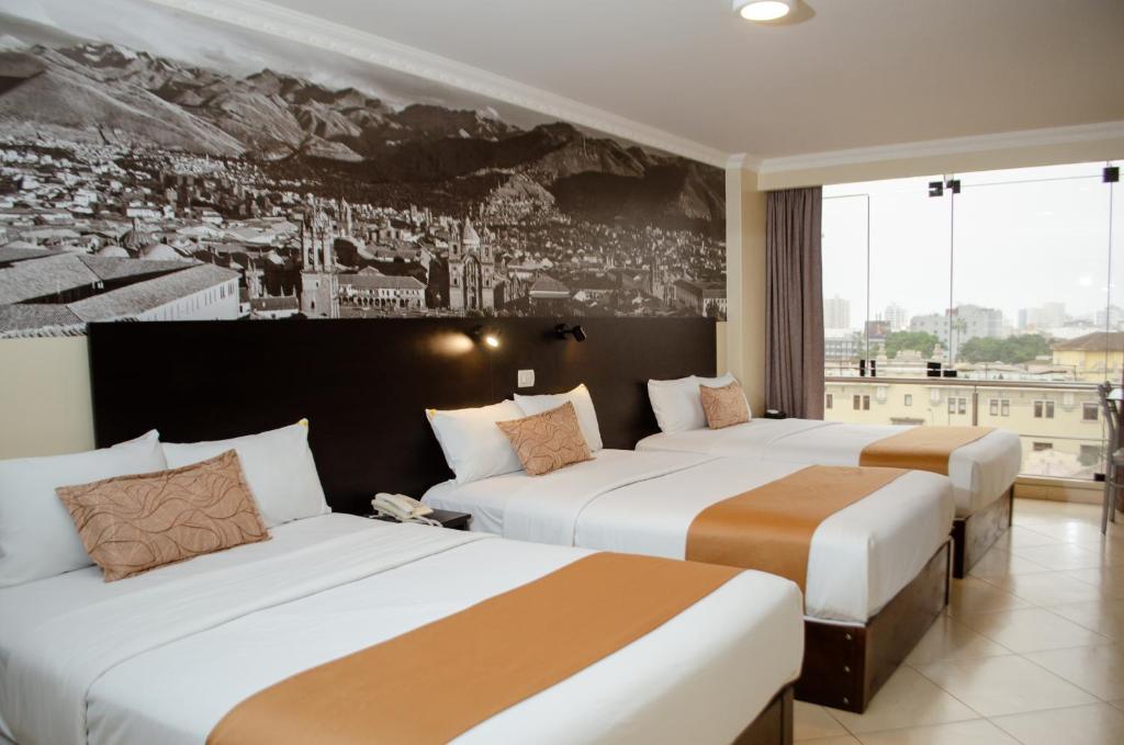 Postel nebo postele na pokoji v ubytování Hotel María Luisa